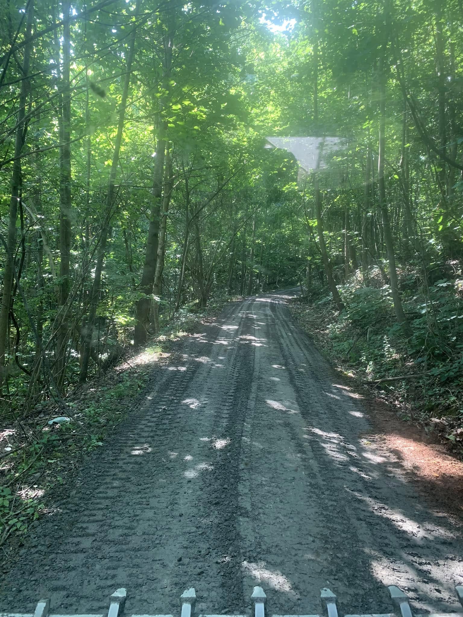 Dump truck hauling dirt and debris on a Cullman County job site