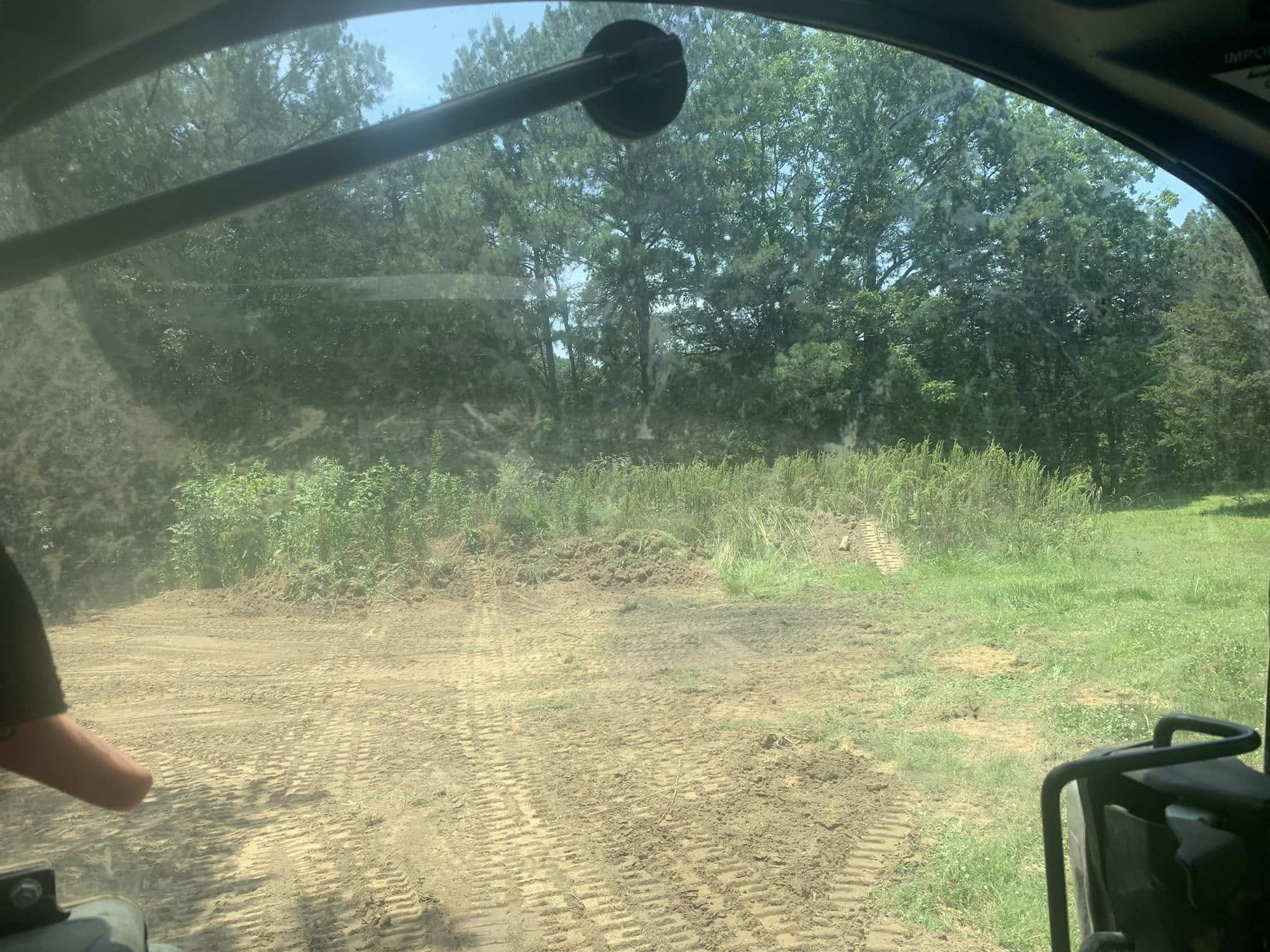 Grading and leveling a driveway for proper drainage in Cullman County
