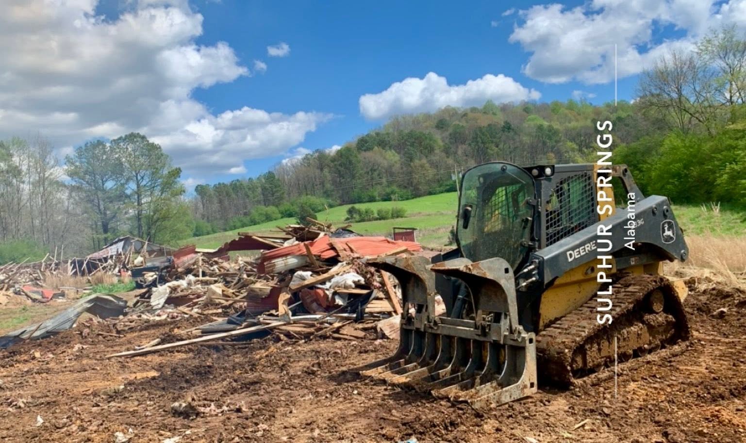 Land clearing crew clearing overgrown property in Cullman County